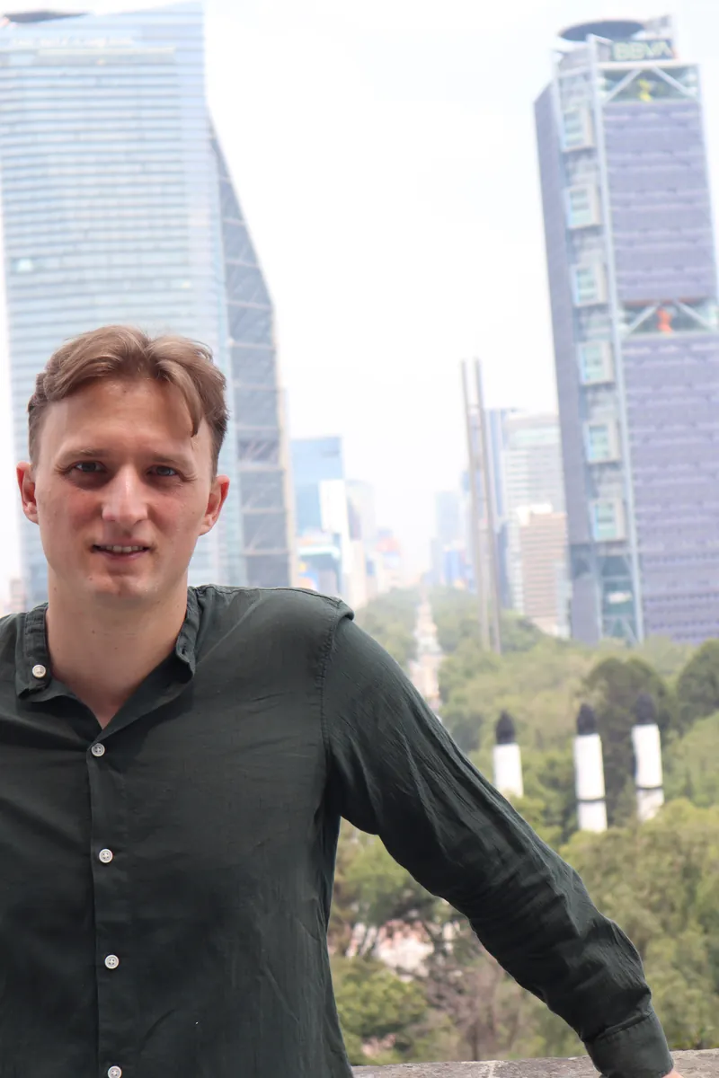 Lukas Oberbichler with a city skyline in the background